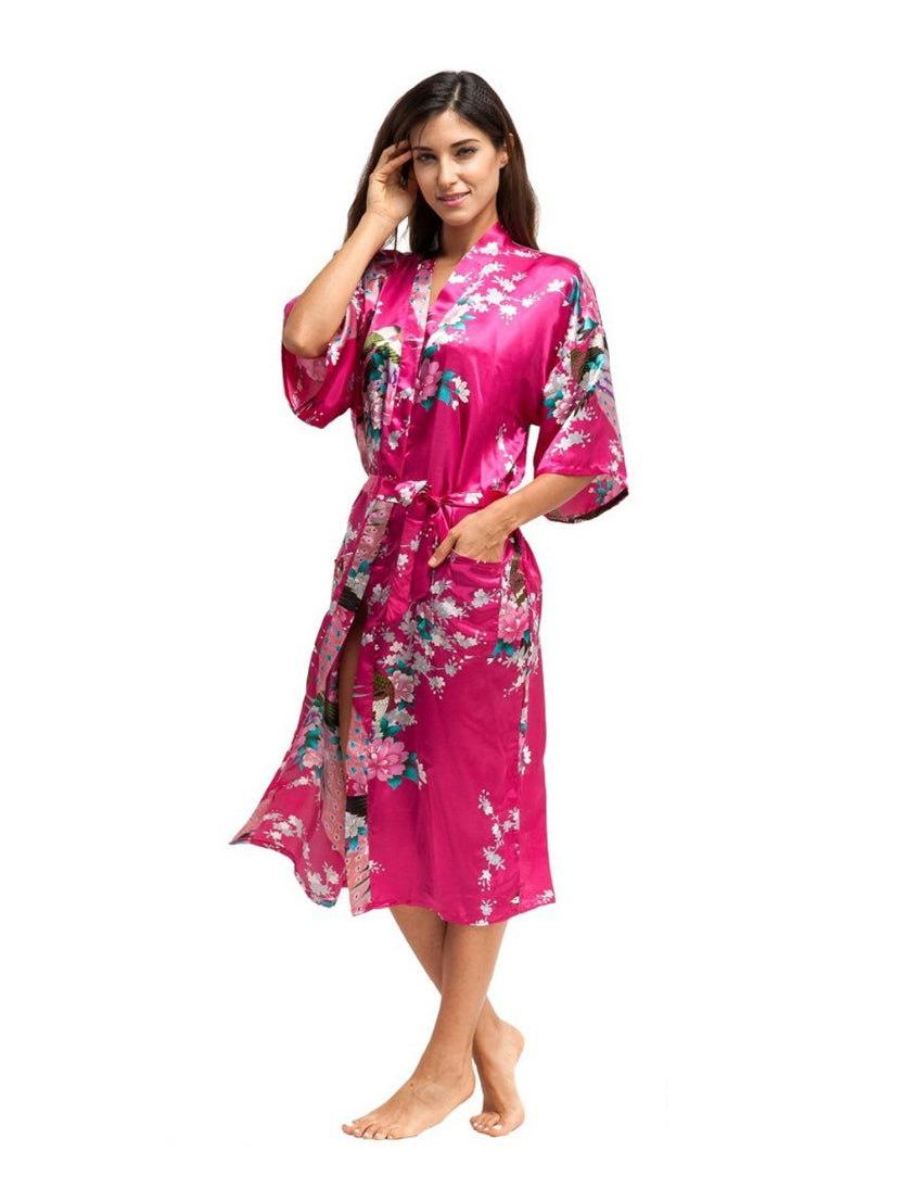 This stunning long satin Japanese floral print robe glides around your shoulders and is super smooth and silky to the touch. With a matching satin belt to secure around the waist. 